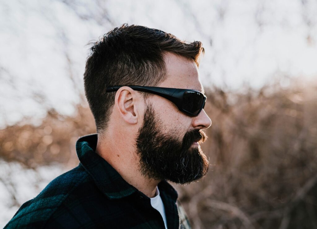 Man In Blue And Black Jacket Wearing Black Sunglasses